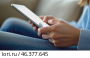 Person using a tablet device. Digital interactions and activities. Man holding a pad. Remote learning, social distance working, ordering buying online, reading e book. Close-Up view, Modern Technology. Стоковое AI-видео, аниматор Марина Демидюк / Фотобанк Лори