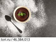Ramekin with tasty lava cake on dark background. Стоковое фото, фотограф Pixel_shot / Фотобанк Лори