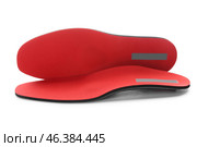 Red orthopedic insoles isolated on white background. Стоковое фото, фотограф Pixel_shot / Фотобанк Лори
