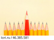 Red pencil among ordinary ones on color background. Concept of uniqueness. Стоковое фото, фотограф Pixel_shot / Фотобанк Лори