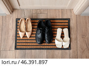 Doormat with shoes in hall, top view. Стоковое фото, фотограф Pixel_shot / Фотобанк Лори