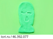 Stylish balaclava on green background. Стоковое фото, фотограф Pixel_shot / Фотобанк Лори