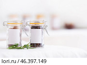 Jars with nutmegs and allspice on shelf in kitchen. Стоковое фото, фотограф Pixel_shot / Фотобанк Лори