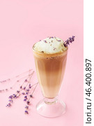 Glass of tasty lavender latte and flowers on color background. Стоковое фото, фотограф Pixel_shot / Фотобанк Лори