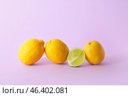 Lime among lemons on color background. Concept of uniqueness. Стоковое фото, фотограф Pixel_shot / Фотобанк Лори