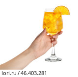Female hand with glass of Aperol spritz cocktail on white background. Стоковое фото, фотограф Pixel_shot / Фотобанк Лори