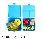 Lunchboxes with delicious food isolated on white background. Стоковое фото, фотограф Pixel_shot / Фотобанк Лори