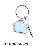 Key with trinket in shape of house on white background. Стоковое фото, фотограф Pixel_shot / Фотобанк Лори