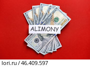 Word ALIMONY with money on color background. Стоковое фото, фотограф Pixel_shot / Фотобанк Лори