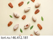 Tasty pecan nuts on light background. Стоковое фото, фотограф Pixel_shot / Фотобанк Лори