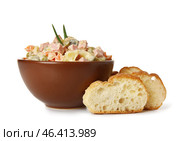 Bowl of tasty Olivier salad and bread on white background. Стоковое фото, фотограф Pixel_shot / Фотобанк Лори