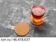 Drink coasters with cup of tea on grey grunge table. Стоковое фото, фотограф Pixel_shot / Фотобанк Лори