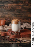 Glass cup of tasty dalgona coffee on table. Стоковое фото, фотограф Pixel_shot / Фотобанк Лори