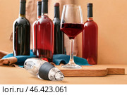 Aerator with glass and bottles of wine on color background. Стоковое фото, фотограф Pixel_shot / Фотобанк Лори