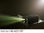 Modern video projector on dark background. Стоковое фото, фотограф Pixel_shot / Фотобанк Лори