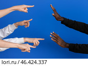 People bulling African-American man on color background. Racism concept. Стоковое фото, фотограф Pixel_shot / Фотобанк Лори
