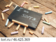 Chalkboard with text I AM SORRY on wooden background. Стоковое фото, фотограф Pixel_shot / Фотобанк Лори