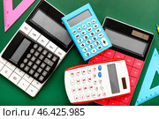 Modern calculators and rulers on color background. Стоковое фото, фотограф Pixel_shot / Фотобанк Лори