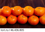 Many tasty clementines on wooden surface. Стоковое фото, фотограф Яков Филимонов / Фотобанк Лори