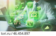 Man is using a laptop with a green screen that has a lot of icons on it. Стоковое AI-видео, аниматор Sergey Grishin / Фотобанк Лори