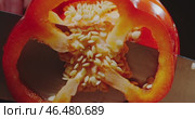 A Detailed CrossSection of a Bright Red Bell Pepper Clearly Revealing Its Seeds and Structure. Стоковое видео, видеограф Владимир Ковальчук / Фотобанк Лори