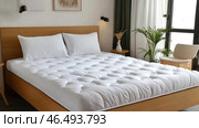 Comfortable mattress topper providing restful sleep in modern bedroom. Стоковое AI-изображение, AI-художник Юрий Поздников / Фотобанк Лори