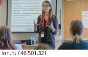 University professor giving a lecture to her students. Стоковое AI-видео, аниматор Юрий Поздников / Фотобанк Лори