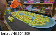 Experience the Colorful Carnival Rubber Duck Game, perfect for enjoying Fun at Seaside Attractions. Редакционное видео, видеограф PAv / Фотобанк Лори