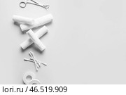 Медицинский пластырь, ватные палочки, бинты и хирургический инструмент на светлом фоне. Стоковое фото, фотограф Pixel_shot / Фотобанк Лори