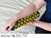 Women's forearm on a needle roller - foot massage using an applicator Kuznetsov, Russia. Стоковое фото, фотограф Володина Ольга / Фотобанк Лори
