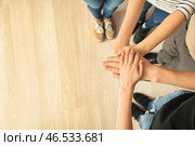 Молодые люди положить руки вместе, вид сверху. Концепция единства. Стоковое фото, фотограф Pixel_shot / Фотобанк Лори
