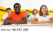 Positive man and woman studying in school for taxi drivers. Стоковое фото, фотограф Яков Филимонов / Фотобанк Лори