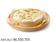 Тарелка вкусной халвы тахини с фисташками на белом фоне. Стоковое фото, фотограф Pixel_shot / Фотобанк Лори