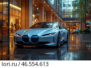 A modern sports coupe with a futuristic design, standing in a stylish urban space. The car is painted in glossy white, and its aerodynamic shapes emphasize elegance and power. The front part stands out with a characteristic grille and narrow LED headlights, giving an aggressive look.The reflection of the car on the wet floor enhances the effect of depth, creating an atmosphere of luxury and modern urbanism. The background is represented by glass facades of buildings with warm lighting, which adds contrast to the cold metallic shade of the car. Стоковое AI-изображение, AI-художник Анна Кривицкая / Фотобанк Лори