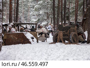 Sestroretsk, Russia - February 19, 2023: Amidst a serene winter backdrop, soldiers in historical attire engage in strategic maneuvers, preparing for battle against the chilling elements of the season. Редакционное фото, фотограф Aleksandr Golubev / Фотобанк Лори