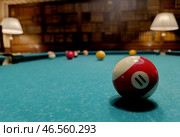 American billiards. The balls are on the green billiard table. We spend time at home playing our favorite sports game. Стоковое фото, фотограф Photojuli / Фотобанк Лори