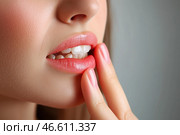 Young woman suffering from herpes on lips, health problems concept. Стоковое AI-изображение, AI-художник Станислав Тарко / Фотобанк Лори