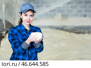 Portrait of woman farmer with handful of fodder. Стоковое фото, фотограф Яков Филимонов / Фотобанк Лори