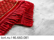 Мусульманский молитвенный коврик на сером фоне. Стоковое фото, фотограф Pixel_shot / Фотобанк Лори