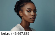 Beautiful portrait of a natural African-American girl on a neutral blue background. Cosmetology, skin care, facial care and makeup. Стоковое AI-изображение, AI-художник Photojuli / Фотобанк Лори