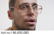 Goofy Glasses Guy with Exaggerated Shock Face. Стоковое видео, видеограф Илья Шаматура / Фотобанк Лори
