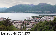Озеро Маджоре и город Локарно в пасмурный день. Швейцария. Май. Lake Maggiore and the city of Locarno on a cloudy day. Switzerland. May. Стоковое видео, видеограф Горшков Александр / Фотобанк Лори