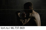 Boxer doing exercises with a rope for slope, dives and punches. Стоковое фото, фотограф David Kashakhi / Фотобанк Лори