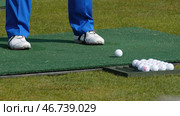Golfer Hitting Golf Shot with Club on the Course. Стоковое фото, фотограф David Kashakhi / Фотобанк Лори
