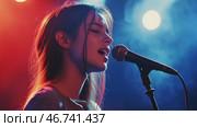 Young sensual female singer performs song on stage in red blue light. Стоковое AI-видео, аниматор Елена Никишина / Фотобанк Лори