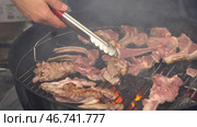 Cooking barbecue steak on the hot grill in camping time, high definition. Стоковое фото, фотограф David Kashakhi / Фотобанк Лори