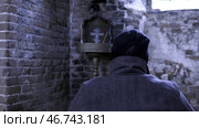 Back view of a man in an abandoned Church. Стоковое фото, фотограф David Kashakhi / Фотобанк Лори