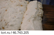 Raw dough with sweet raisins ready for baking. Стоковое фото, фотограф David Kashakhi / Фотобанк Лори
