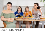 Female friends during family quarrel accuse Asian woman. Стоковое фото, фотограф Яков Филимонов / Фотобанк Лори