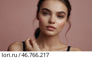Beautiful portrait of a natural girl on a neutral pink background. Cosmetology, skin care, facial care and makeup. Стоковое AI-изображение, AI-художник Photojuli / Фотобанк Лори